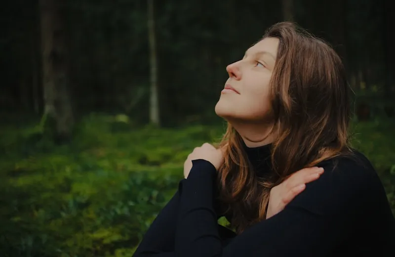 Woman in a calm mindful moment in nature
